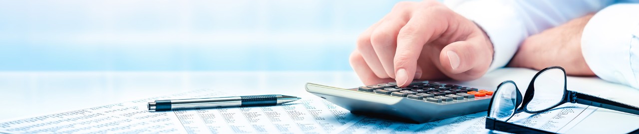 man working with calculator